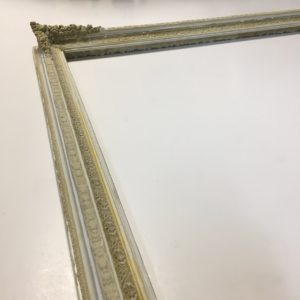 Ornamental picture frame restoration with compo repair detail